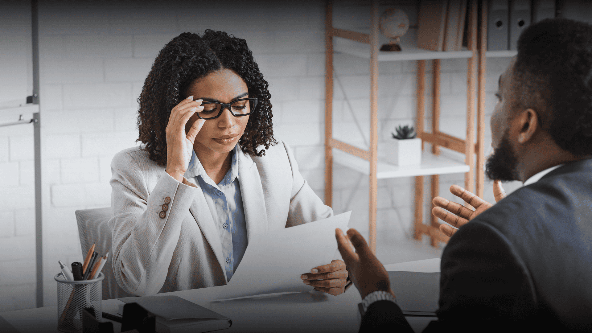 A stressed recruiter reviewing a job application, representing the 10-30 second resume rule and the need for high-impact content.